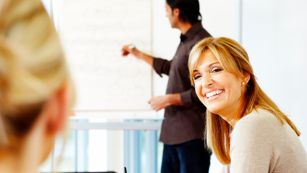 This is a photo of a woman who is confident and self-aware. She is smiling. 